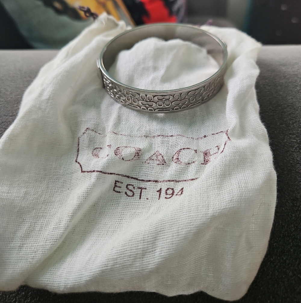 Coach Silver-Tone Logo Engraved Bangle Bracelet